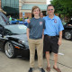Show organizer Brian Ratcliff (right) with son Alex in front of Ratcliff’s 2005 Ferrari F430 Spider